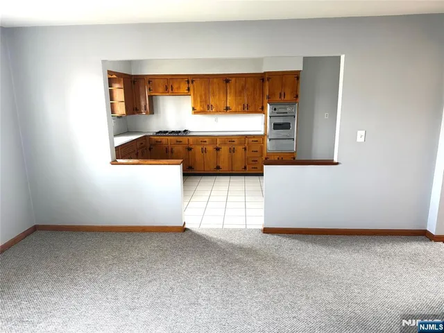 a view of a livingroom with furniture and a flat screen tv