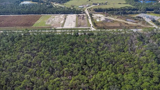 a view of a tennis ground with a small yard
