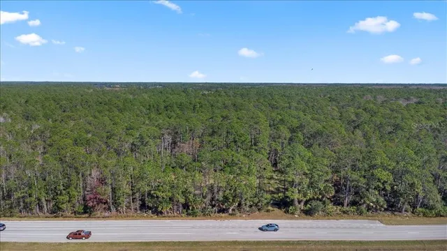 a view of a yard with an outdoor space