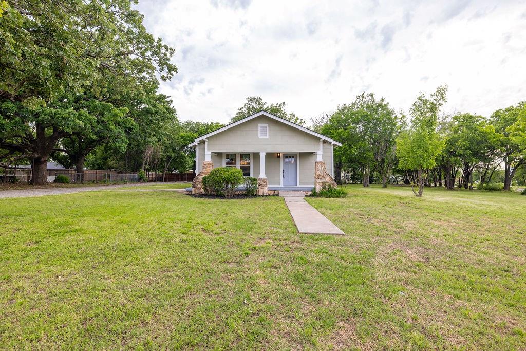 711 Fannin Street Nocona, TX 76255 - Photo 1 of 35 a view of a house with a yard