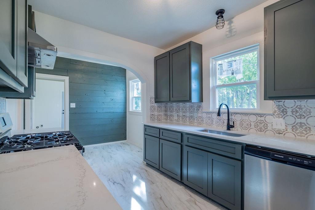 711 Fannin Street Nocona, TX 76255 - Photo 12 of 35 a bathroom with a sink and a mirror