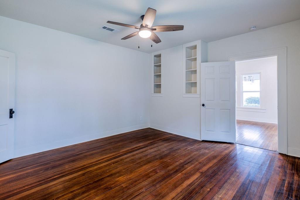 711 Fannin Street Nocona, TX 76255 - Photo 24 of 35 a view of empty room with wooden floor