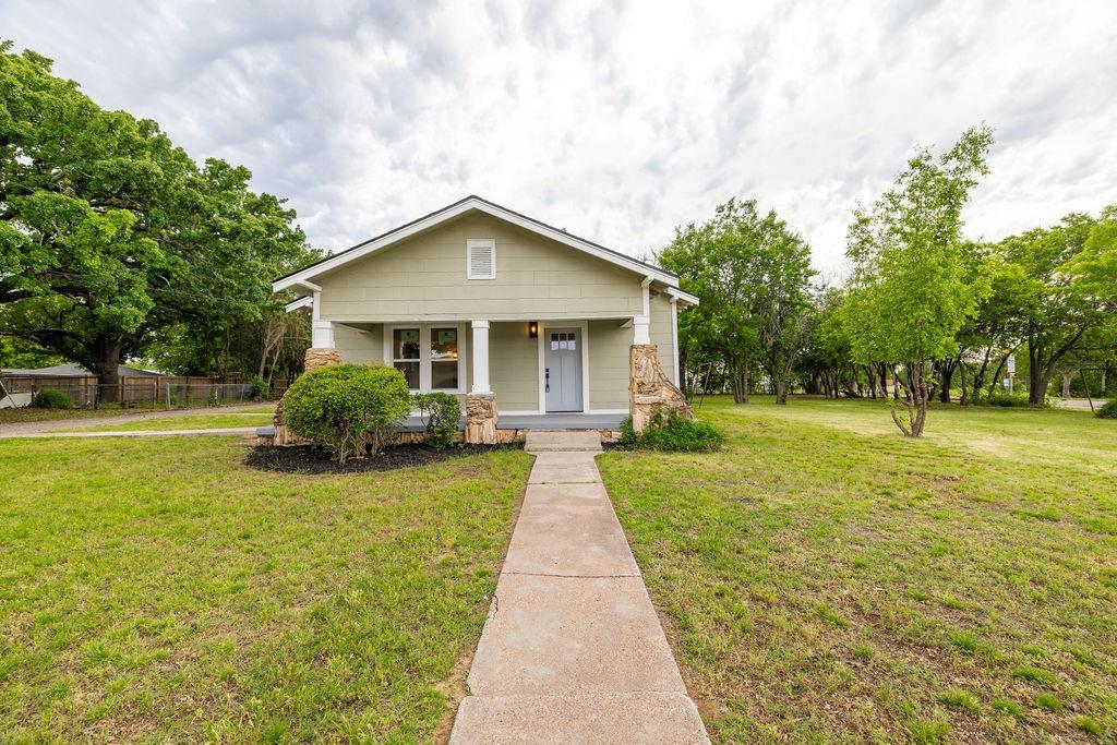 711 Fannin Street Nocona, TX 76255 - Photo 30 of 35 a front view of a house with yard and green space