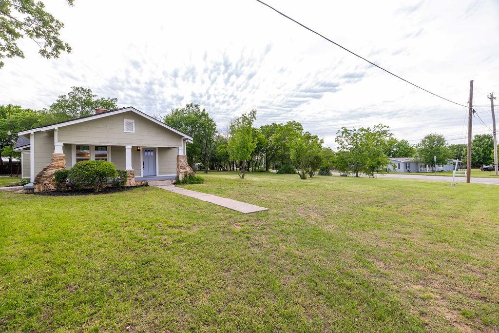711 Fannin Street Nocona, TX 76255 - Photo 35 of 35 a front view of a house with a yard