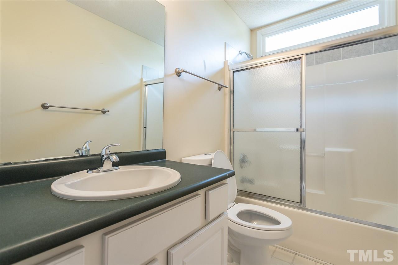 2100 Havering Place Raleigh, NC 27604 - Photo 17 of 27 a bathroom with a sink toilet and shower