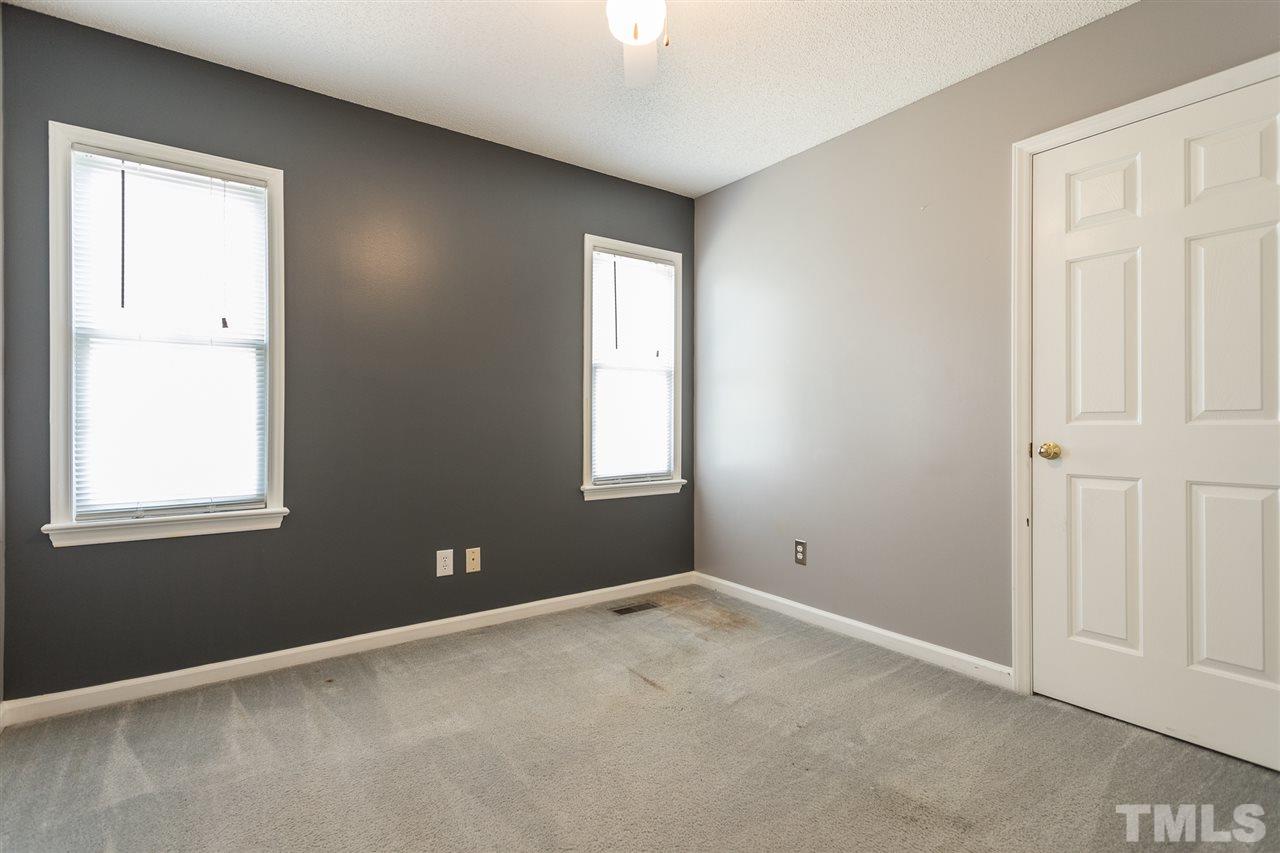 2100 Havering Place Raleigh, NC 27604 - Photo 18 of 27 an empty room with windows and closet