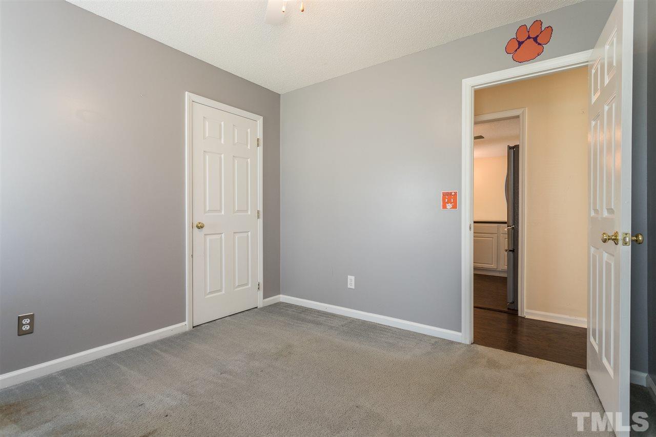2100 Havering Place Raleigh, NC 27604 - Photo 19 of 27 an empty room with closet and windows