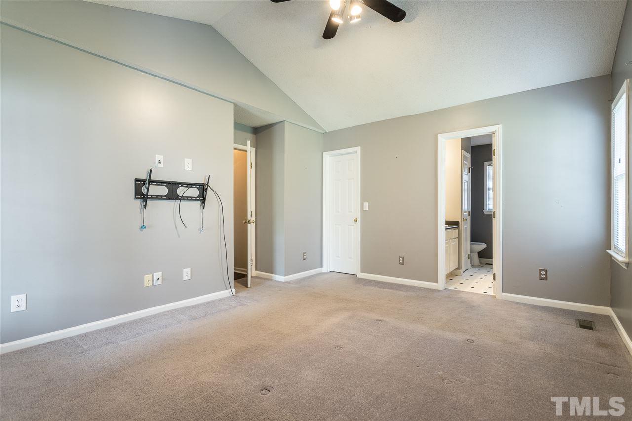 2100 Havering Place Raleigh, NC 27604 - Photo 21 of 27 an empty room with closet and windows