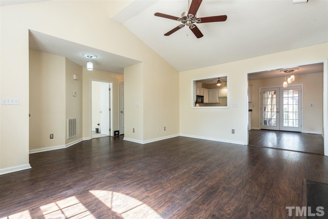 2100 Havering Place Raleigh, NC 27604 - Photo 4 of 27 an empty room with wooden floor and windows