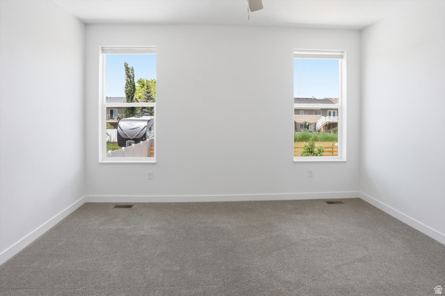 3636 West 910 South Syracuse, UT 84075 - Photo 11 of 70 Neutral-toned wall-to-wall carpeting complements clean white walls