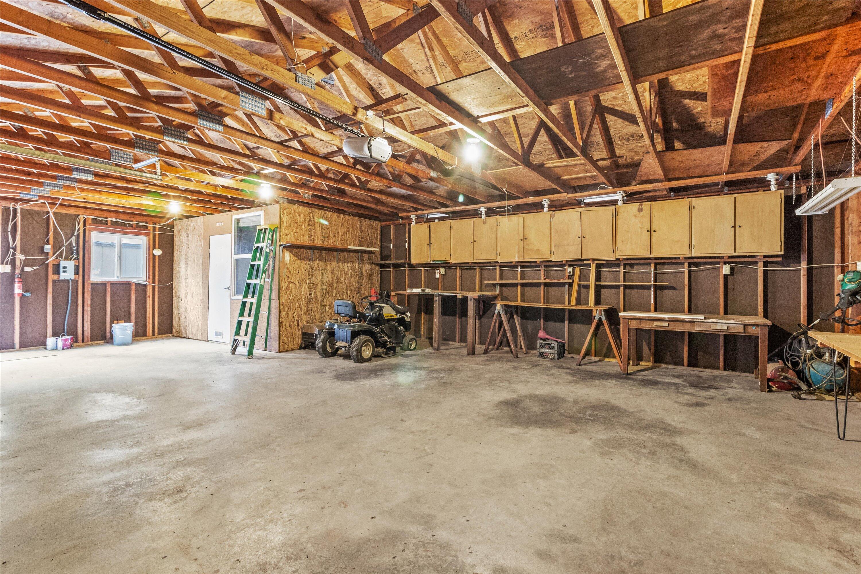535 Round Prairie Road Wilderville, OR 97543 - Photo 28 of 31 Interior of garage and workshop area. Plenty of room to park cars and work on projects!
