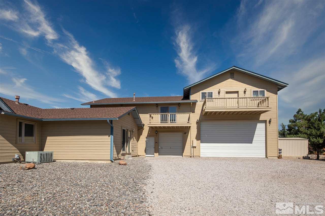 855 Lampe Road Reno, NV 89511 - Photo 15 of 30 a front view of a house with a yard and garage