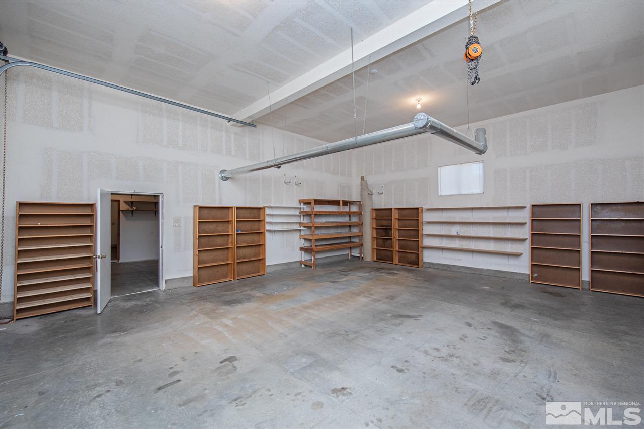 855 Lampe Road Reno, NV 89511 - Photo 16 of 30 a view of an empty room with stairs and a furniture