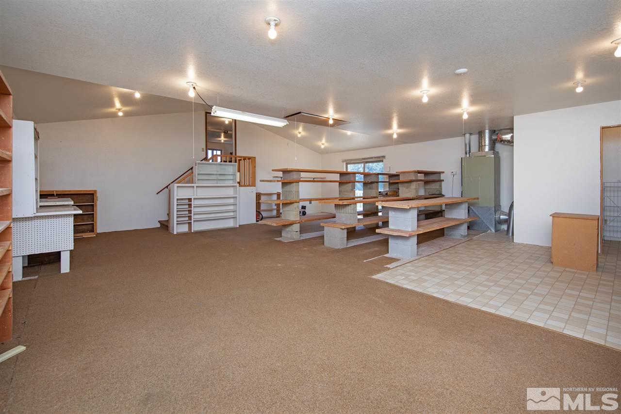 855 Lampe Road Reno, NV 89511 - Photo 20 of 30 a big room with lots of furniture and a chandelier
