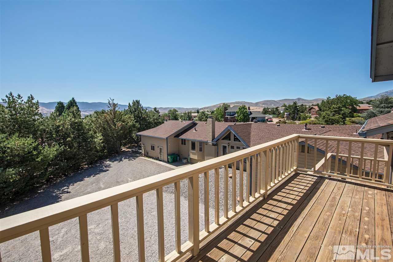 855 Lampe Road Reno, NV 89511 - Photo 25 of 30 a view of balcony with wooden floor and fence