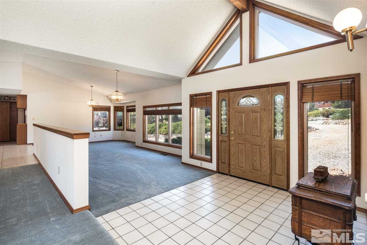 855 Lampe Road Reno, NV 89511 - Photo 3 of 30 a view of a hallway with living room and dining room