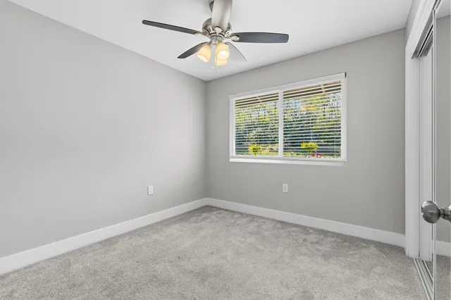 a bathroom with a granite countertop sink a toilet and bathtub