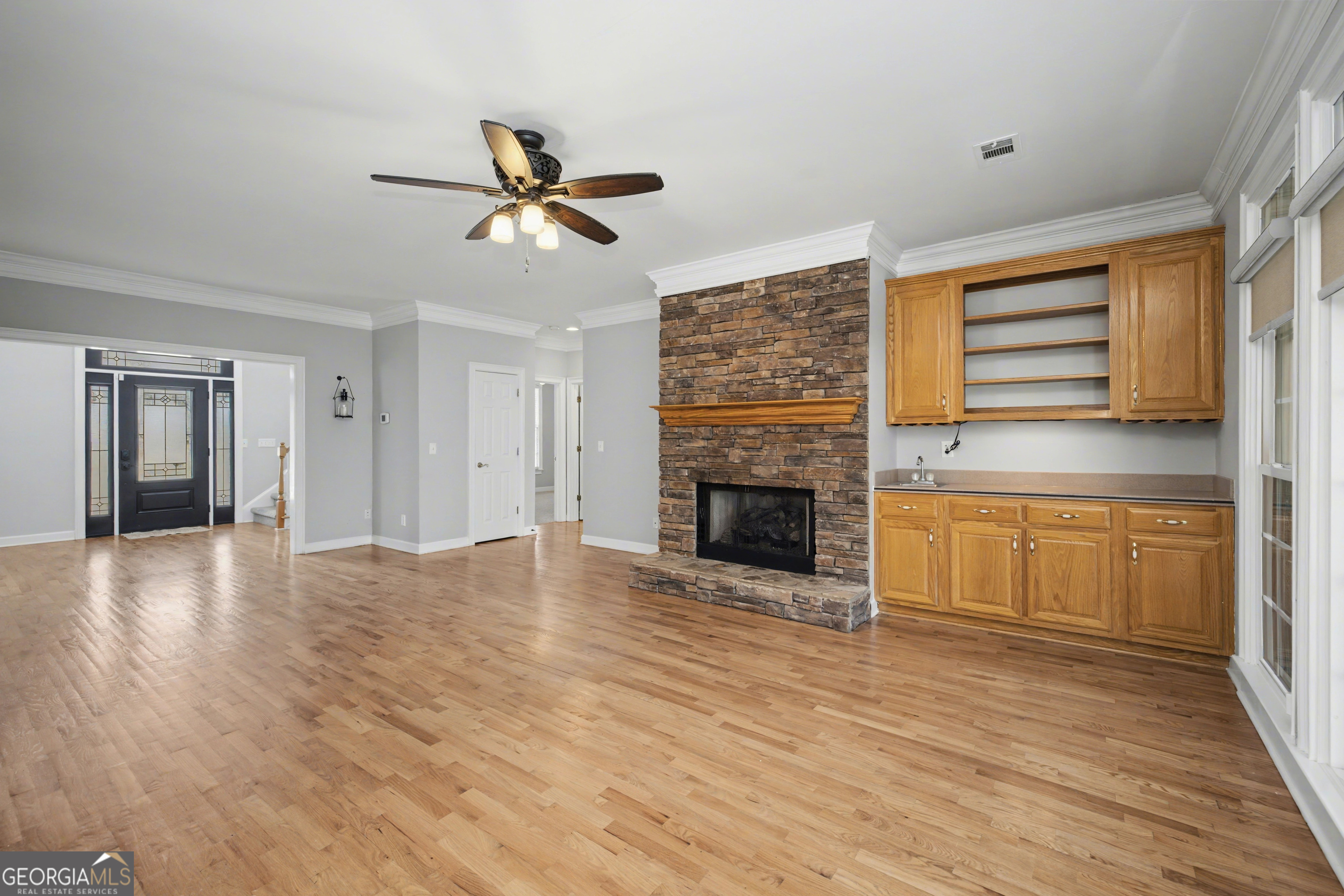 159 Friar Tuck Road Fayetteville, GA 30215 - Photo 13 of 68 a view of empty room with wooden floor and fan