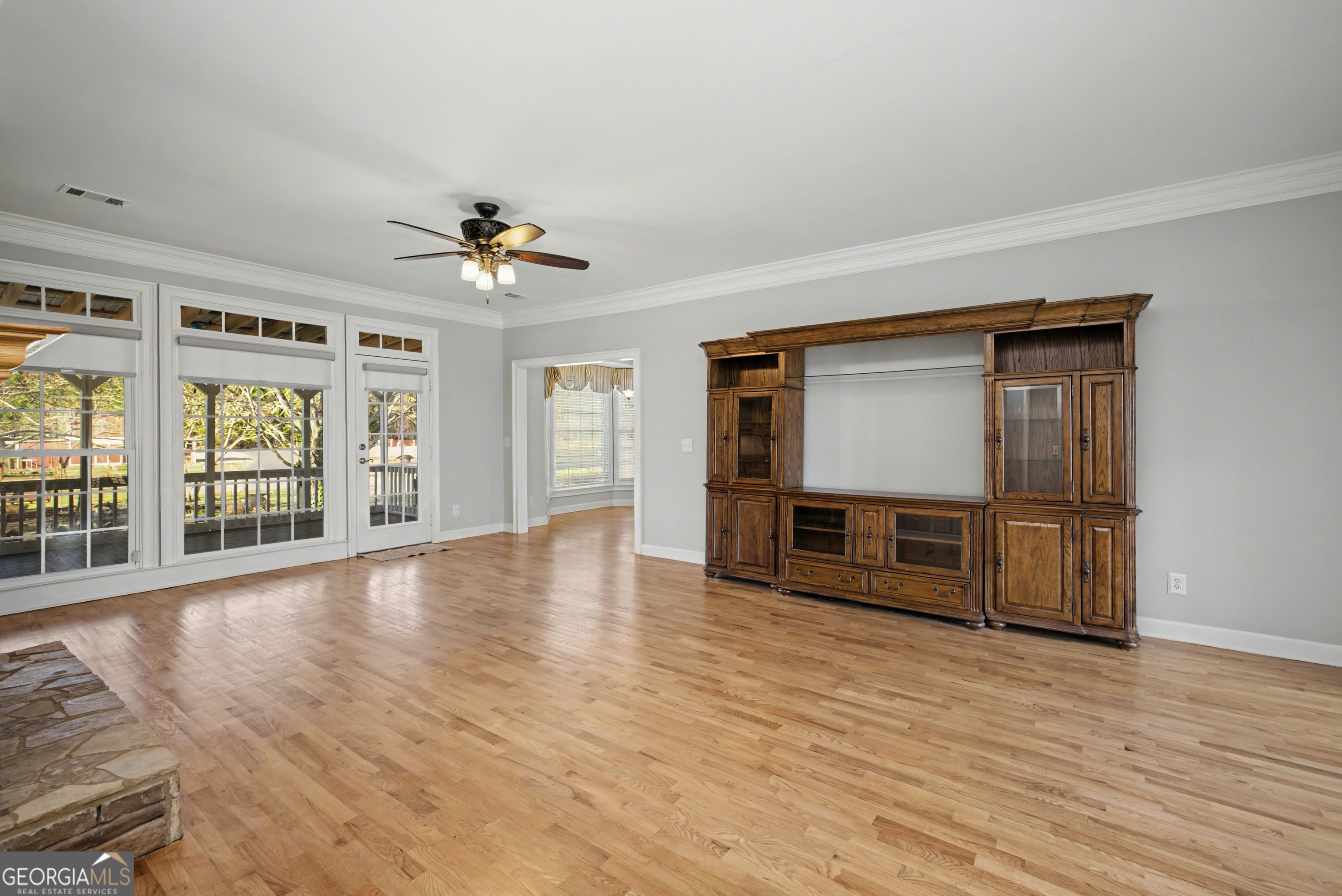 159 Friar Tuck Road Fayetteville, GA 30215 - Photo 14 of 68 wooden floor in an empty room with a window