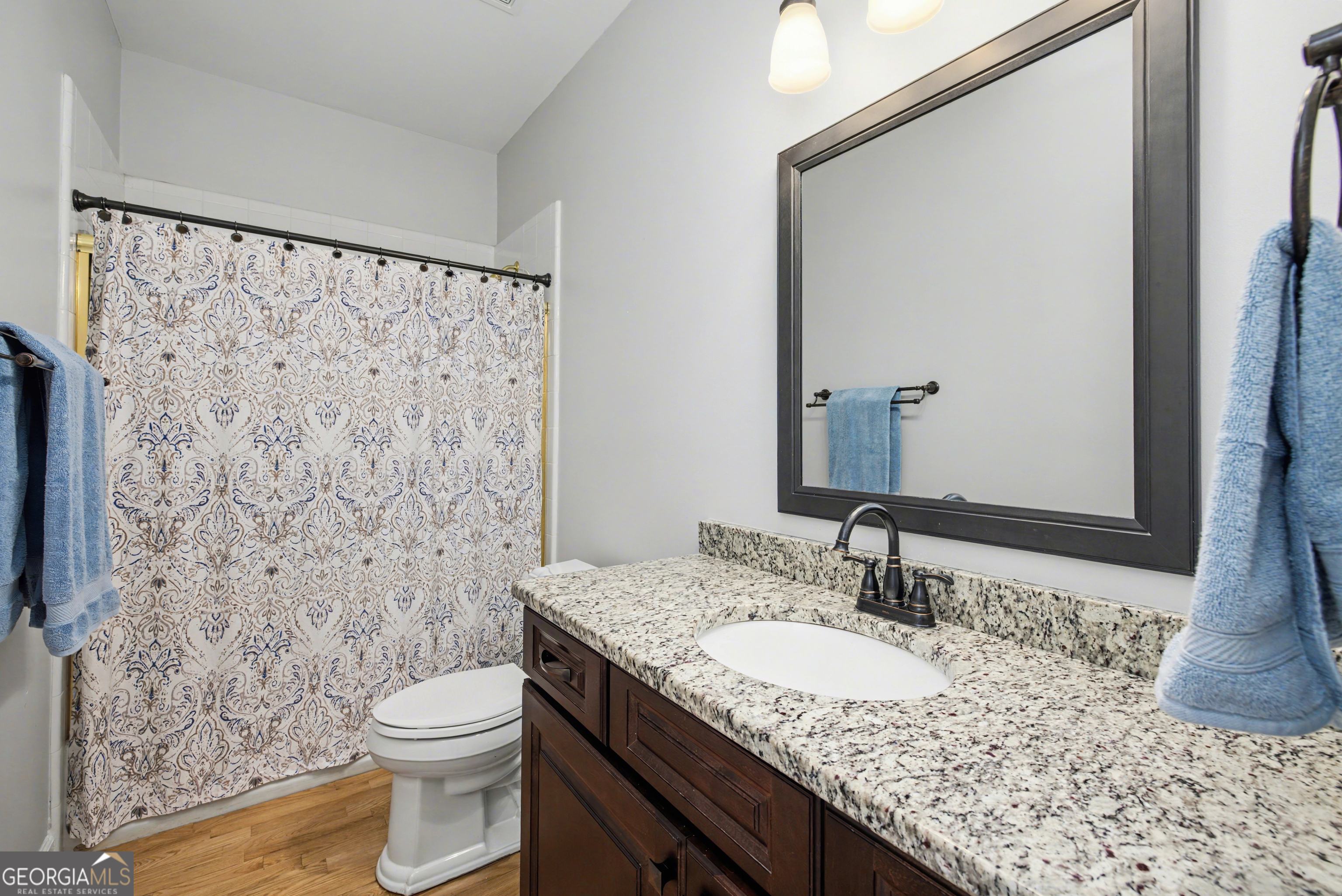 159 Friar Tuck Road Fayetteville, GA 30215 - Photo 15 of 68 a bathroom with a granite countertop sink toilet and shower