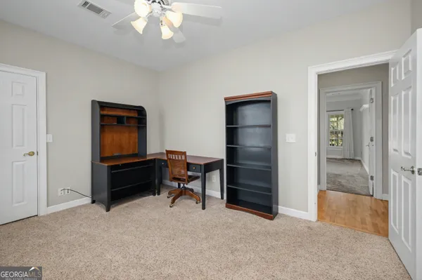 a view of an empty room with a window