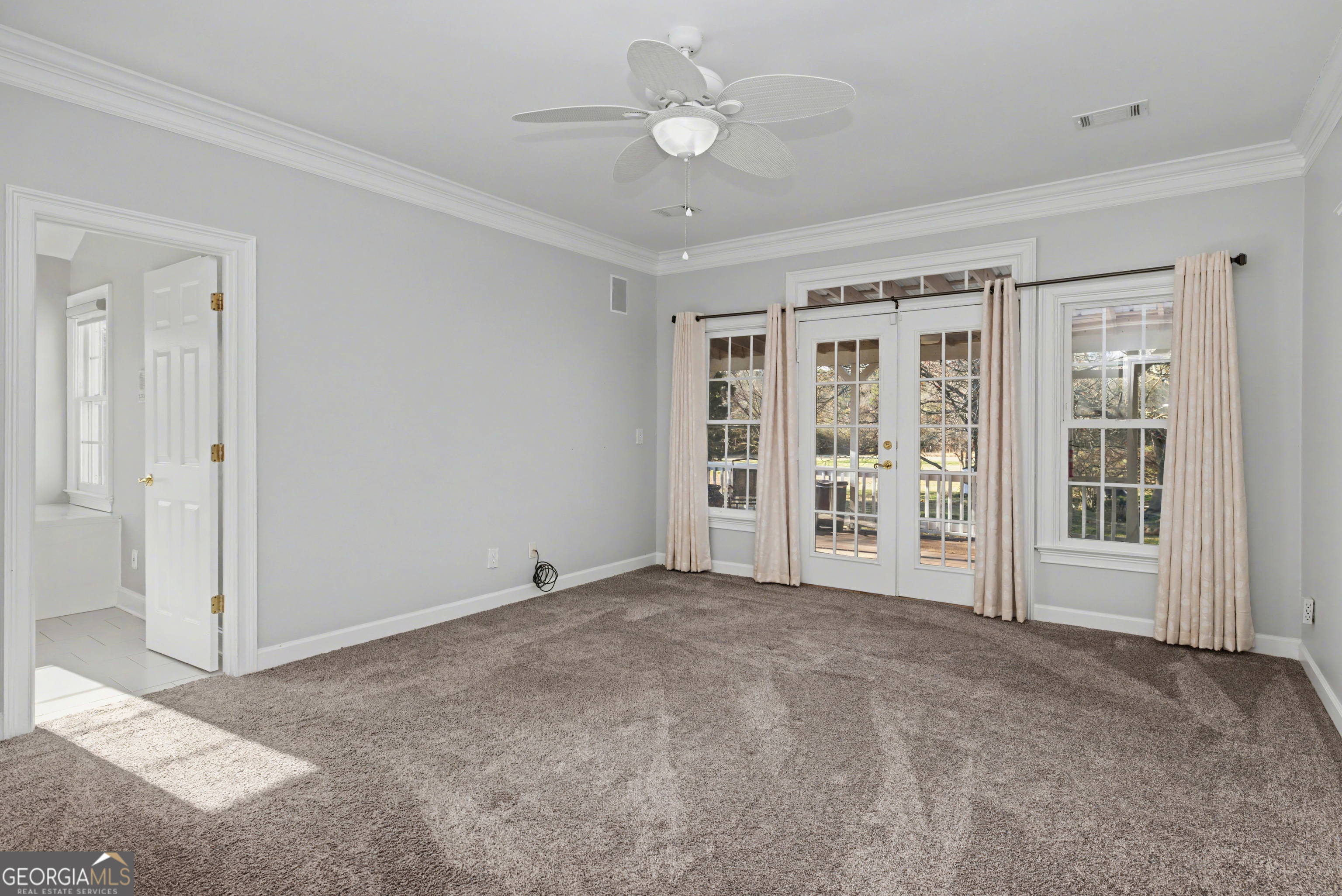159 Friar Tuck Road Fayetteville, GA 30215 - Photo 18 of 68 a view of an empty room with a window