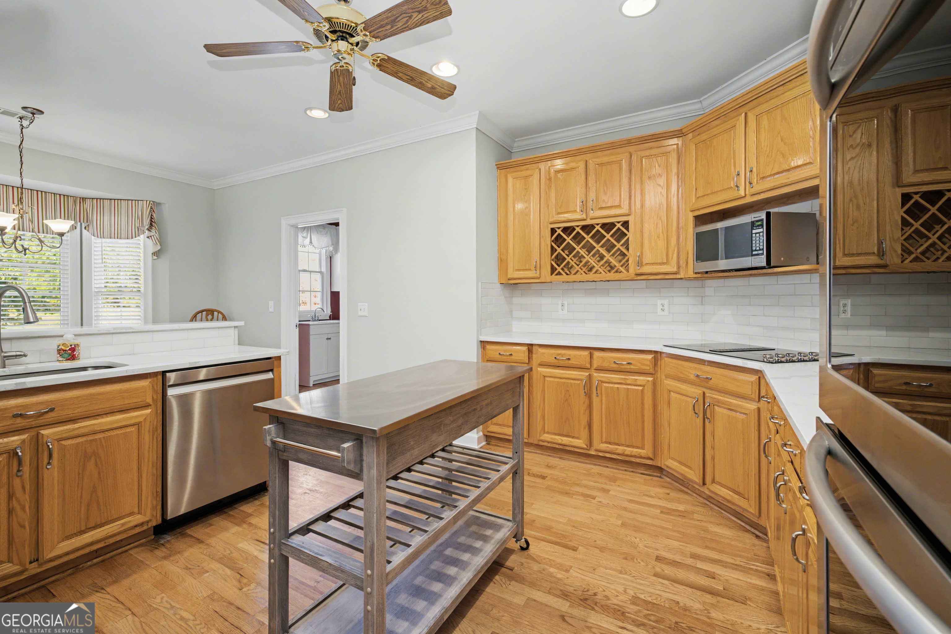 159 Friar Tuck Road Fayetteville, GA 30215 - Photo 28 of 68 a kitchen with stainless steel appliances granite countertop a sink and stove top oven
