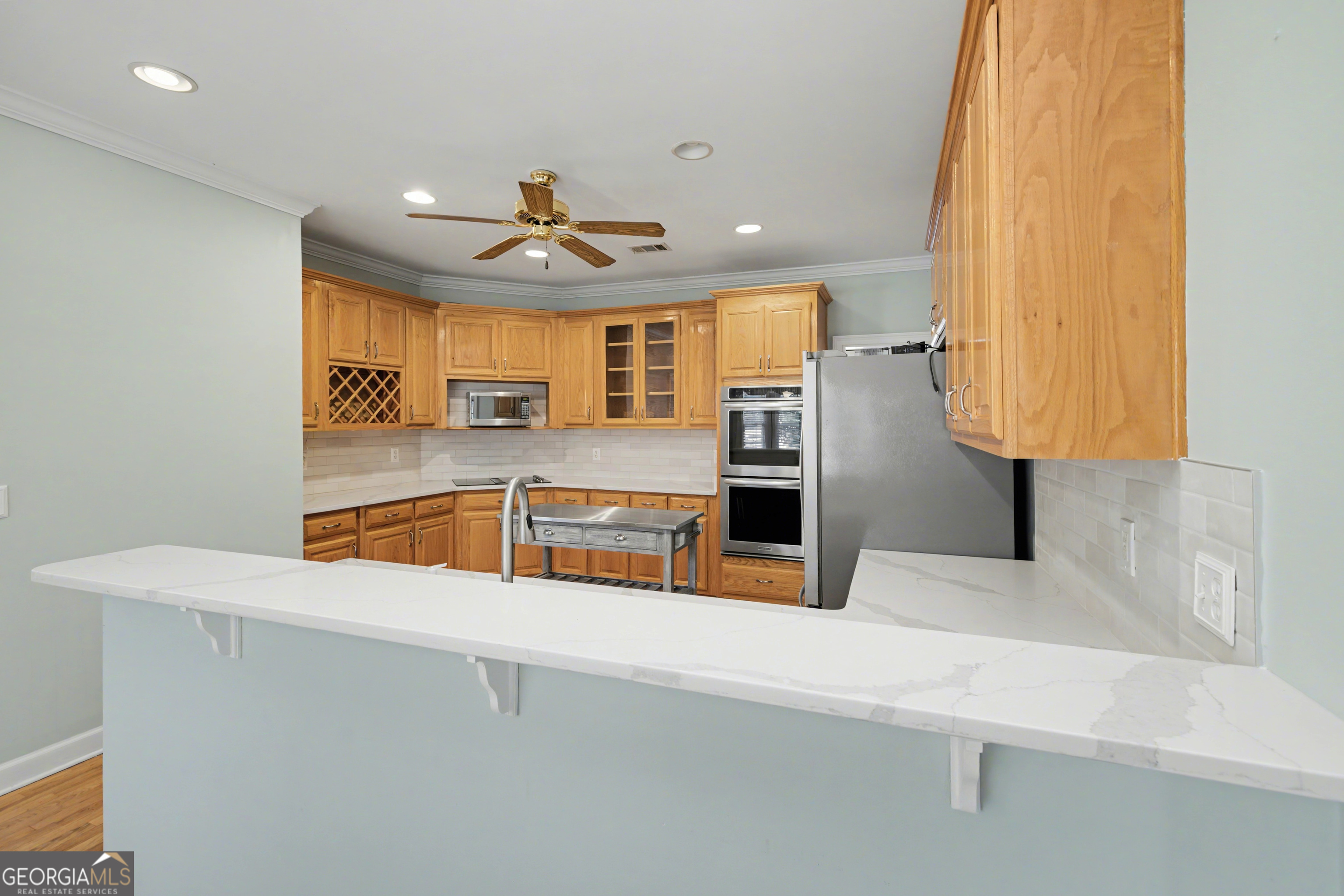 159 Friar Tuck Road Fayetteville, GA 30215 - Photo 29 of 68 a kitchen with stainless steel appliances granite countertop a sink and a refrigerator