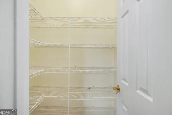 an empty room with closet area