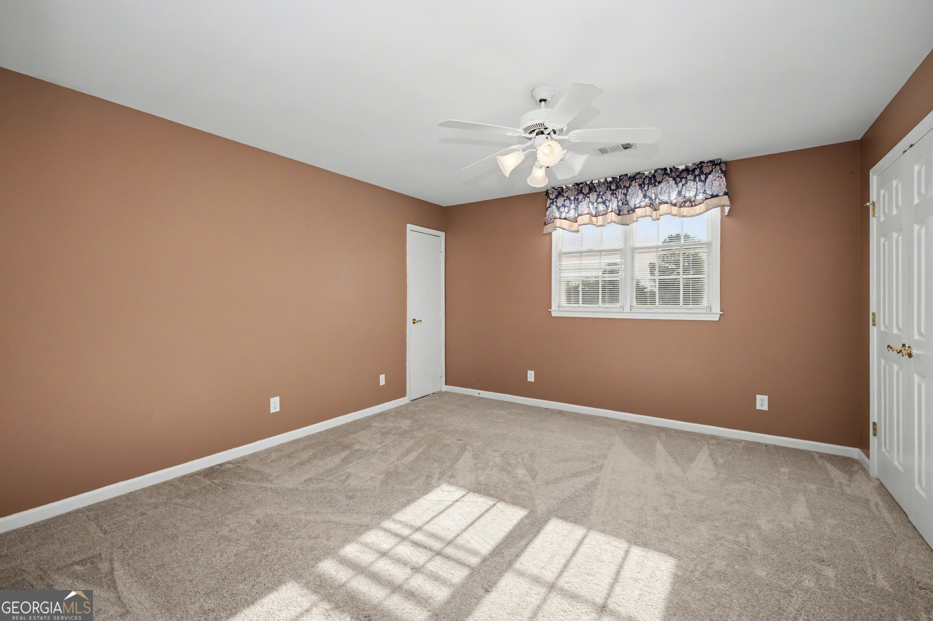 159 Friar Tuck Road Fayetteville, GA 30215 - Photo 36 of 68 a view of an empty room with a window