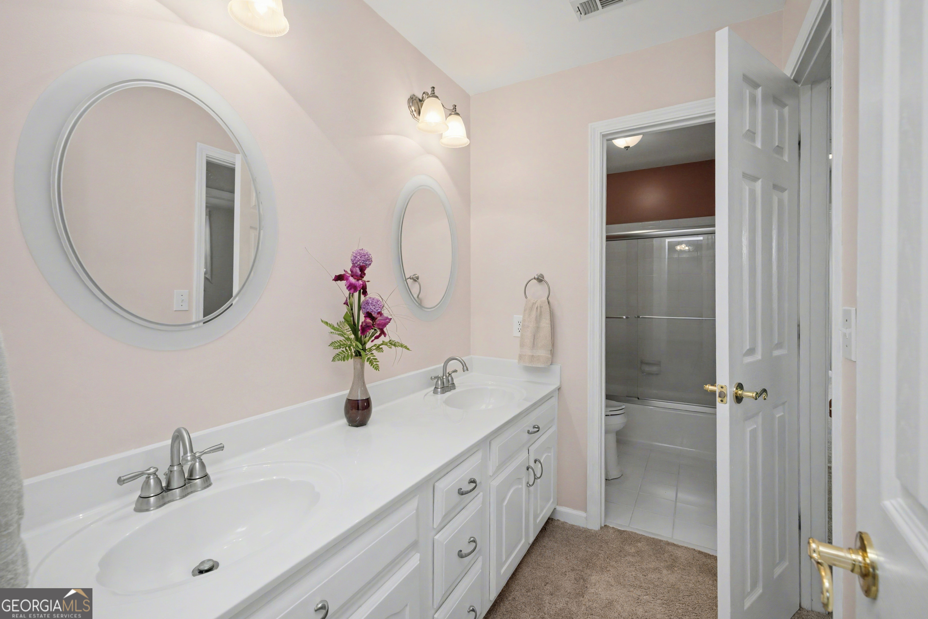 159 Friar Tuck Road Fayetteville, GA 30215 - Photo 42 of 68 a bathroom with a double vanity sink mirror and shower