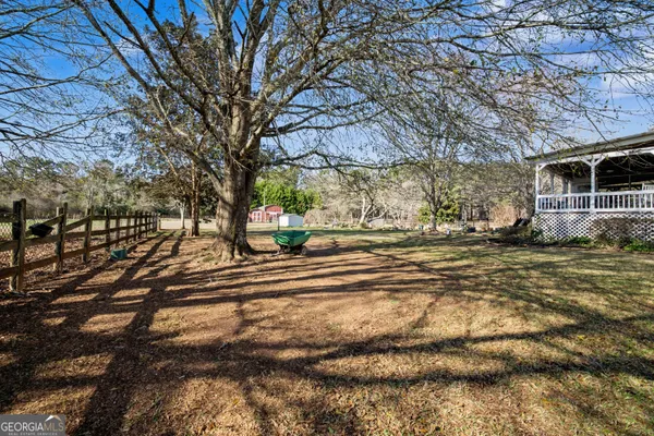 an aerial view of a house with a yard covered with snow