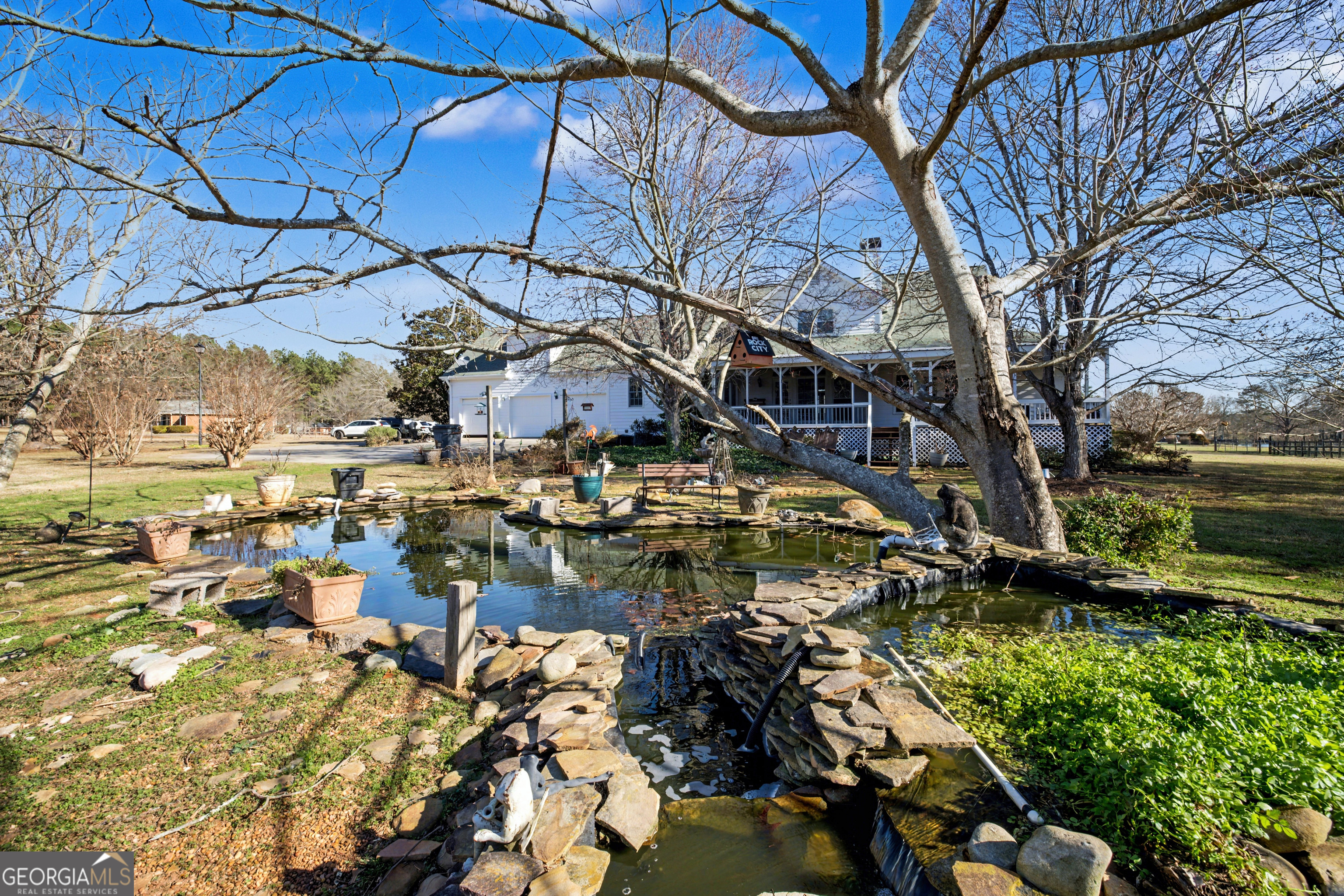 159 Friar Tuck Road Fayetteville, GA 30215 - Photo 50 of 68 a view of a yard with plants and large trees