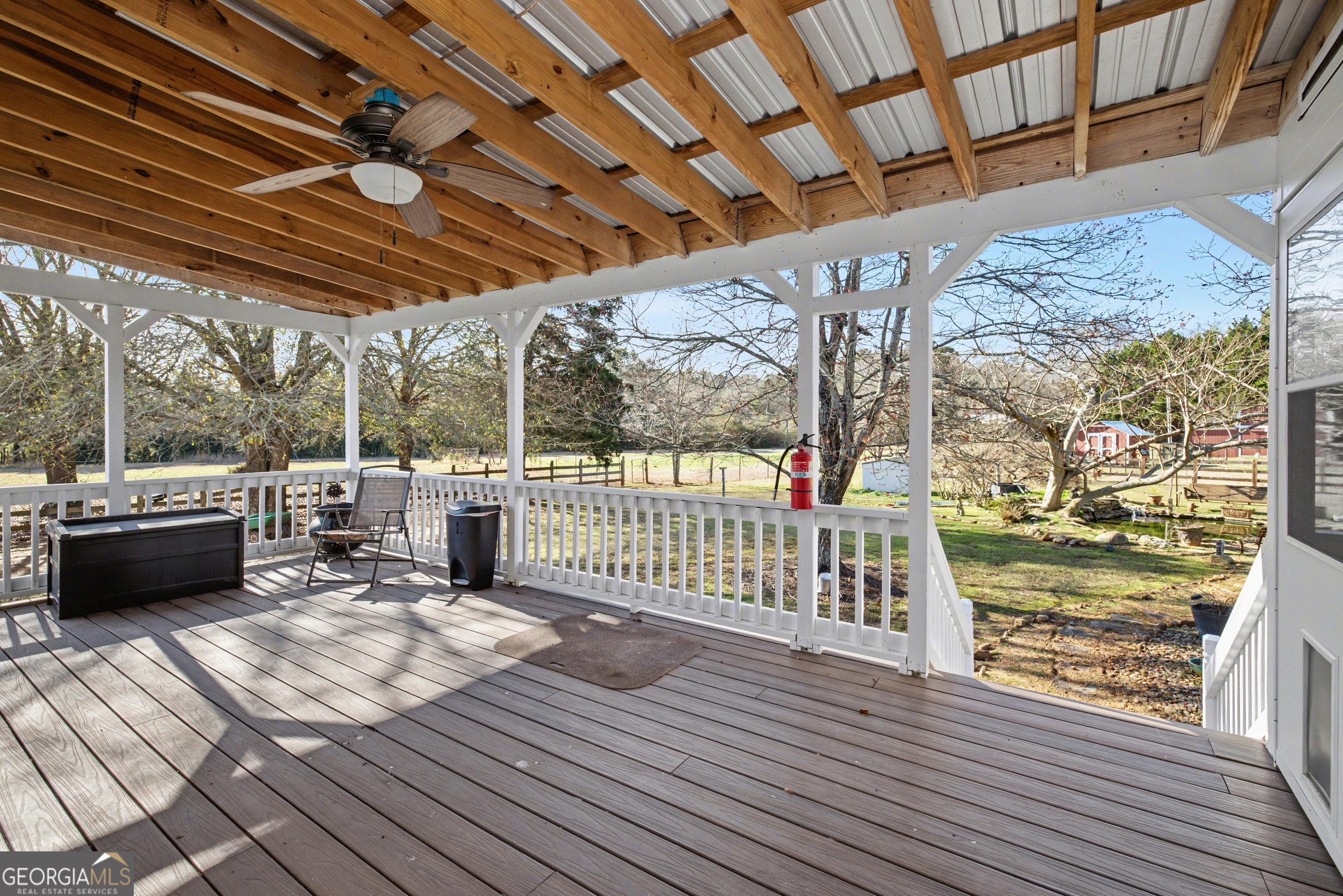 159 Friar Tuck Road Fayetteville, GA 30215 - Photo 51 of 68 a view of a porch with wooden floor
