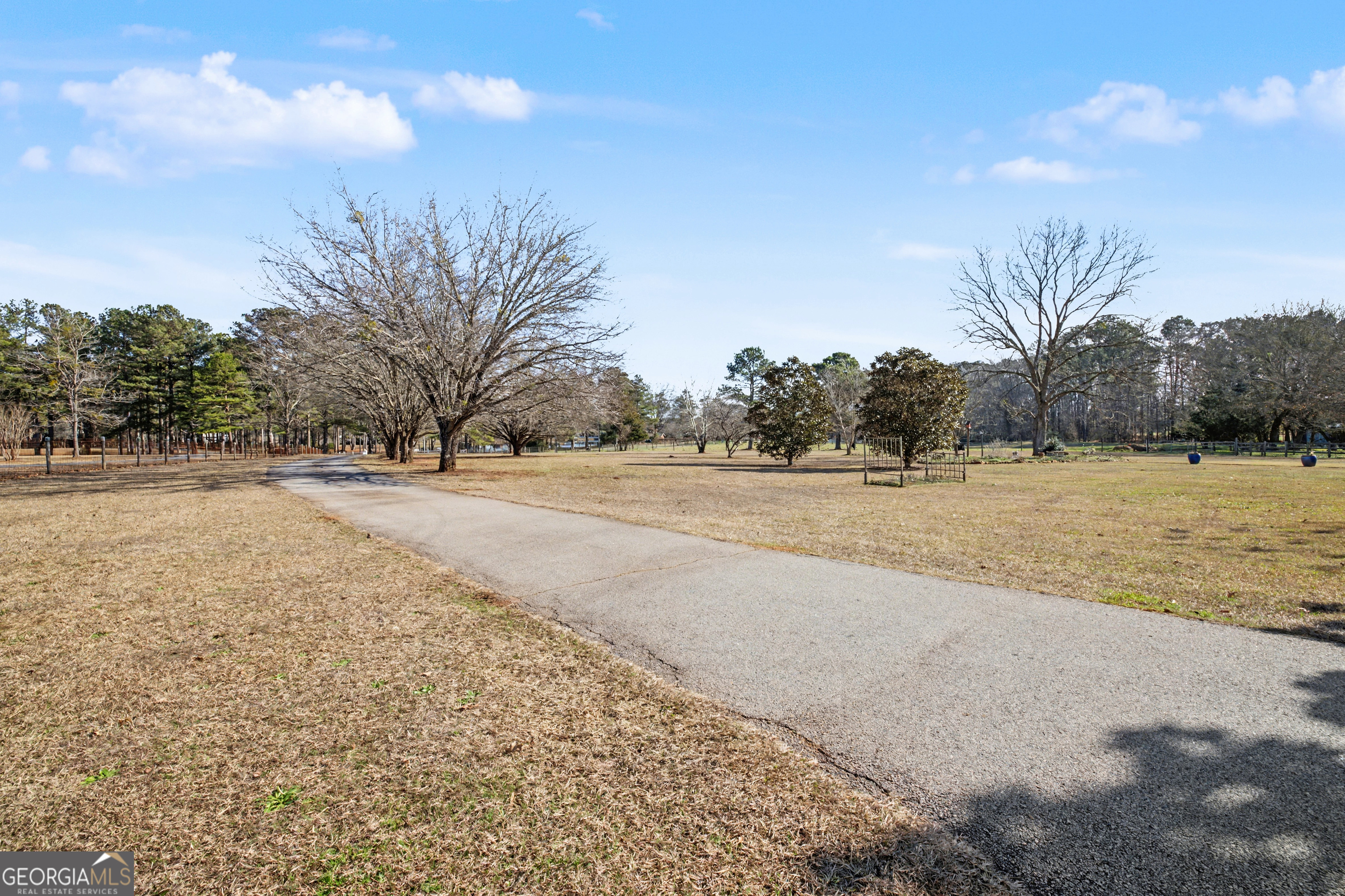 159 Friar Tuck Road Fayetteville, GA 30215 - Photo 53 of 68 a view of dirt field with trees in background