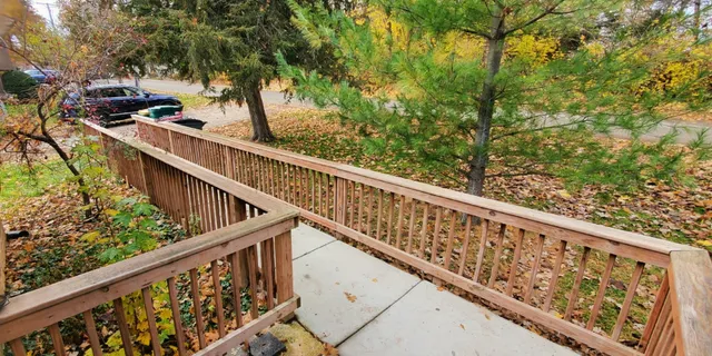 a view of balcony with wooden stairs