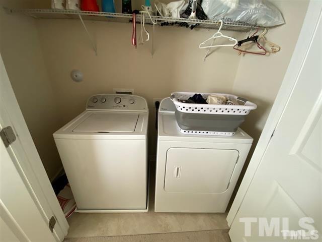 2424 Pecan Ridge Way Apex, NC 27502 - Photo 5 of 9 a utility room with dryer and washer