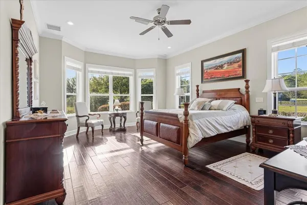 a spacious bathroom with a double vanity sink a mirror a bathtub and a shower
