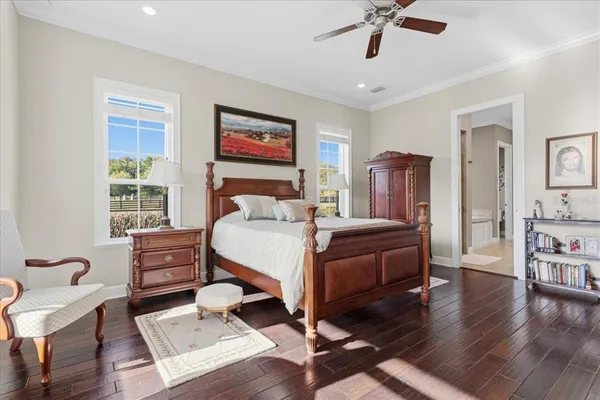 a kitchen with stainless steel appliances granite countertop a kitchen island a stove a table and chairs in it