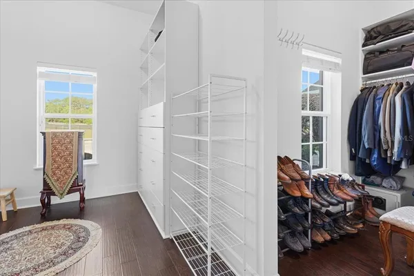 a bedroom with a bed and a view of kitchen