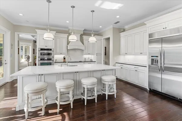 a bathroom with a granite countertop sink a toilet and shower
