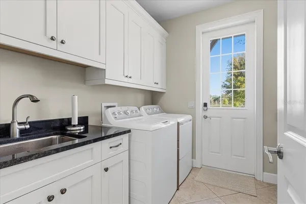 a view of a swimming pool with an outdoor seating and a mountain view