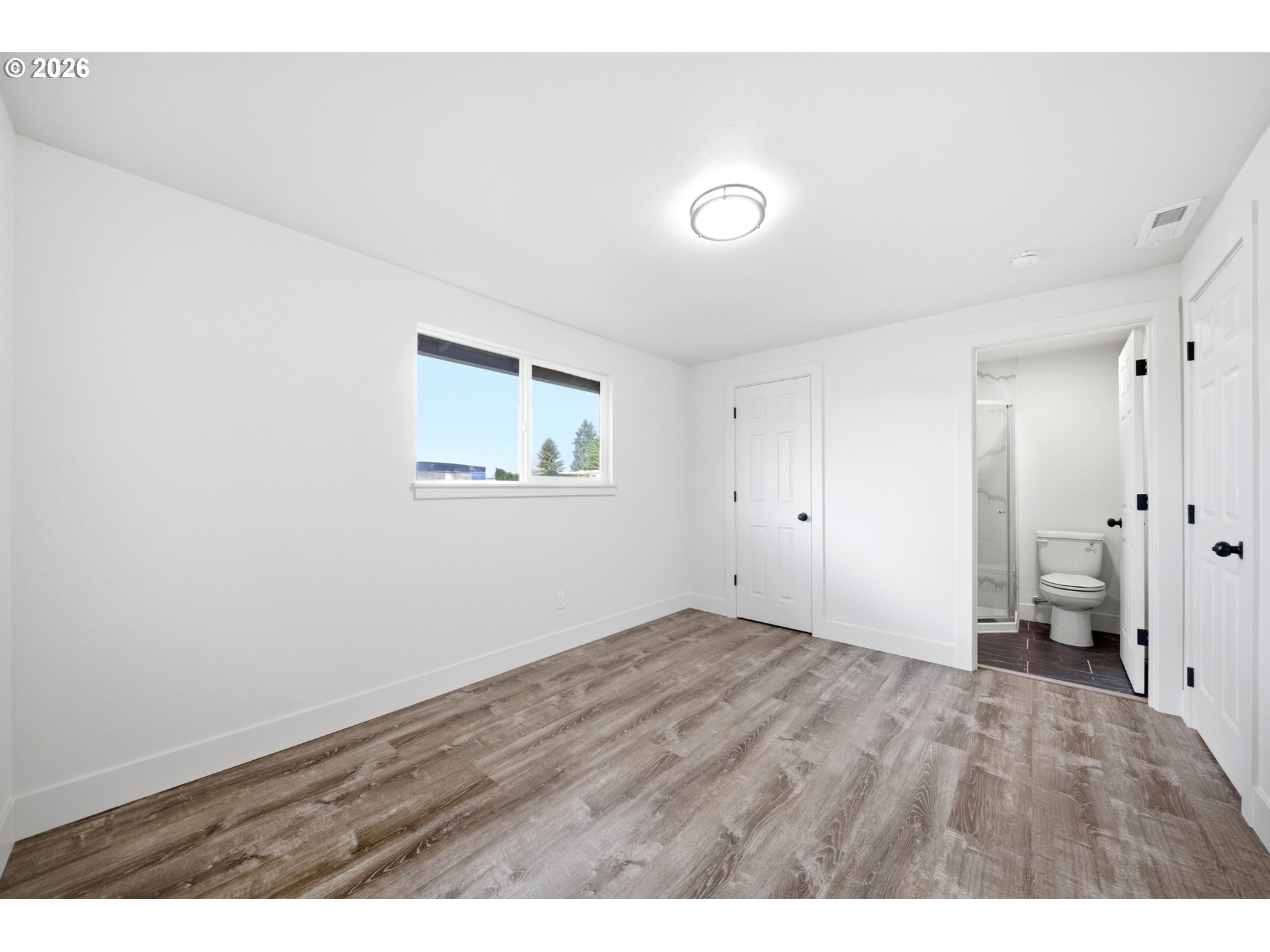 879 North Broadway Street Estacada, OR 97023 - Photo 15 of 37 a view of empty room with wooden floor
