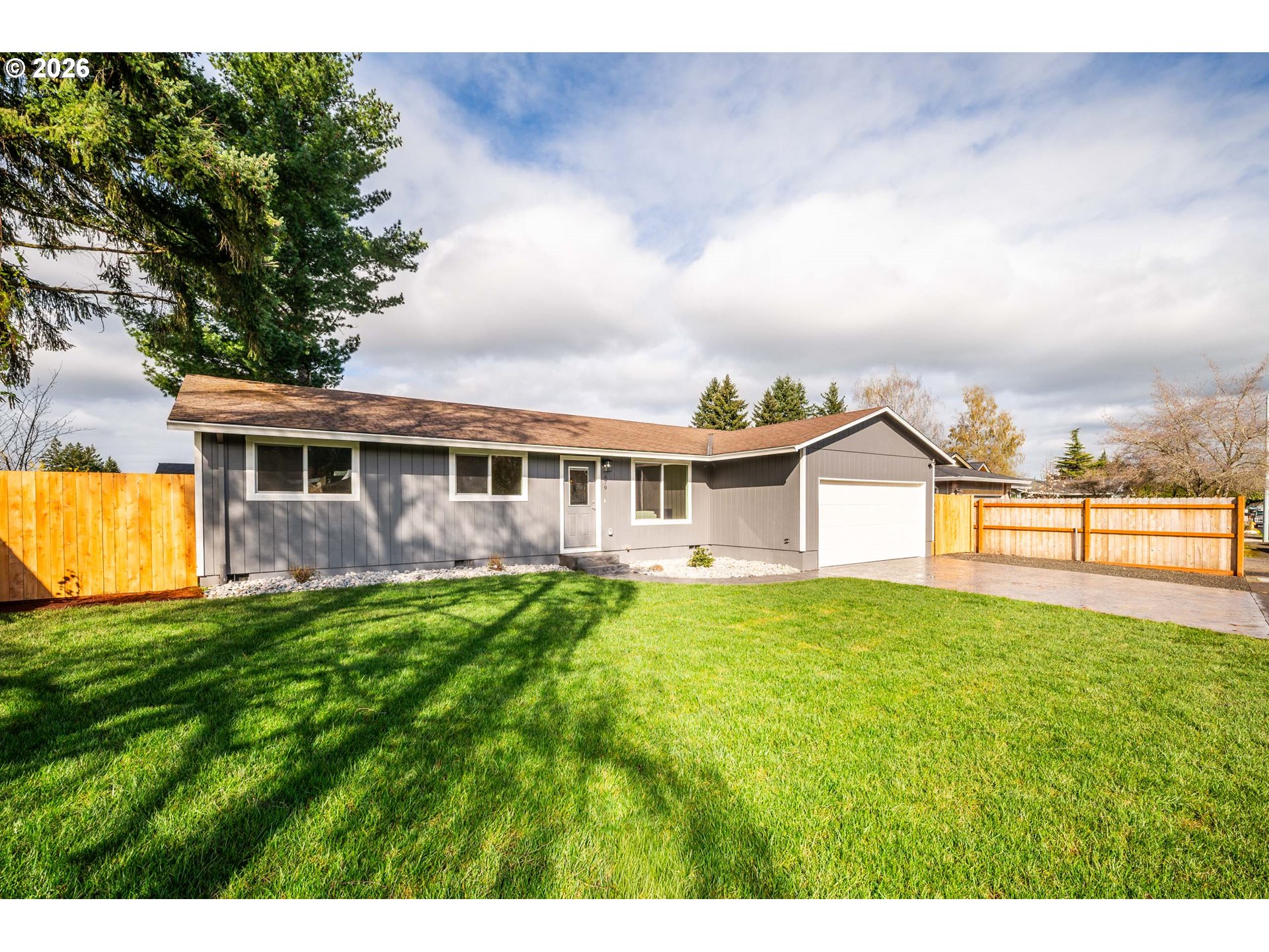 879 North Broadway Street Estacada, OR 97023 - Photo 2 of 37 a view of a house with a yard and sitting area