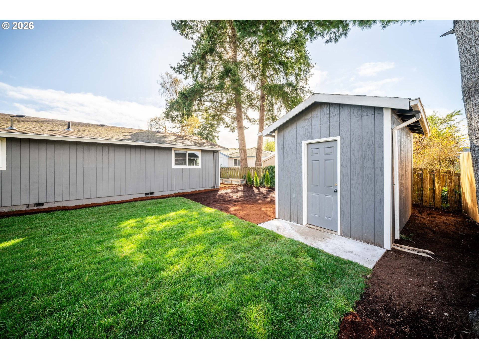 879 North Broadway Street Estacada, OR 97023 - Photo 28 of 37 a backyard of a house with table and chairs