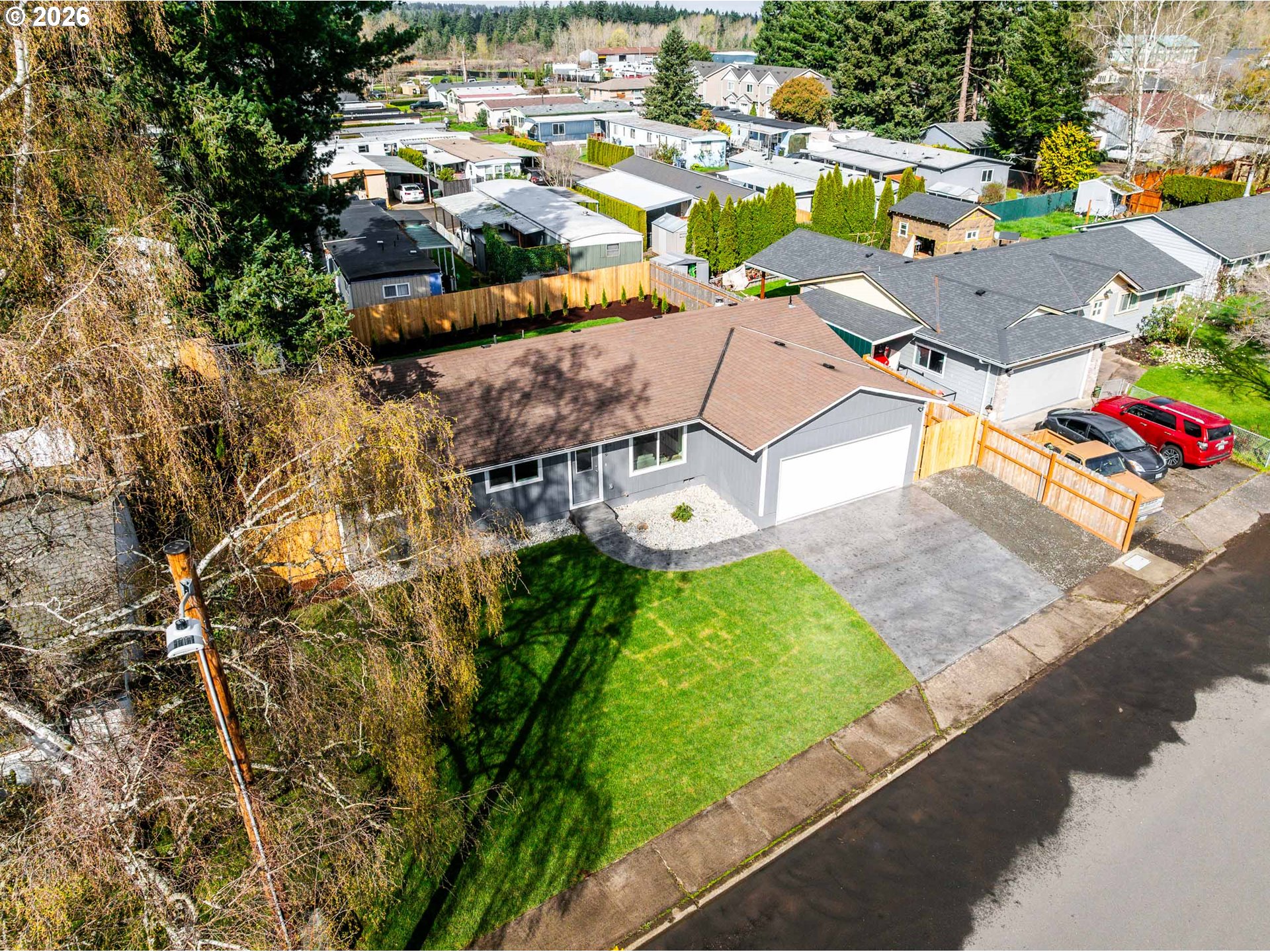 879 North Broadway Street Estacada, OR 97023 - Photo 32 of 37 an aerial view of residential houses with outdoor space and parking