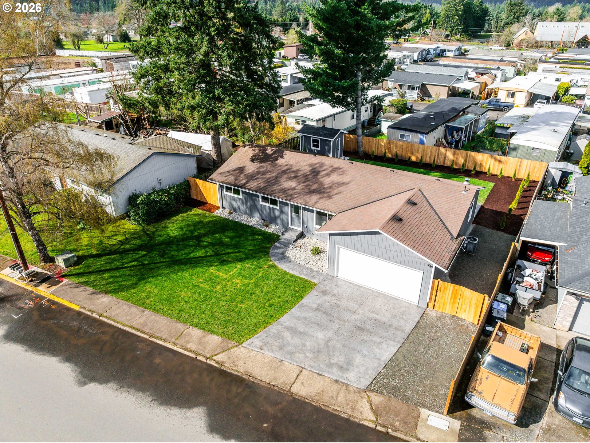 879 North Broadway Street Estacada, OR 97023 - Photo 34 of 37 an aerial view of a house with garden space and street view