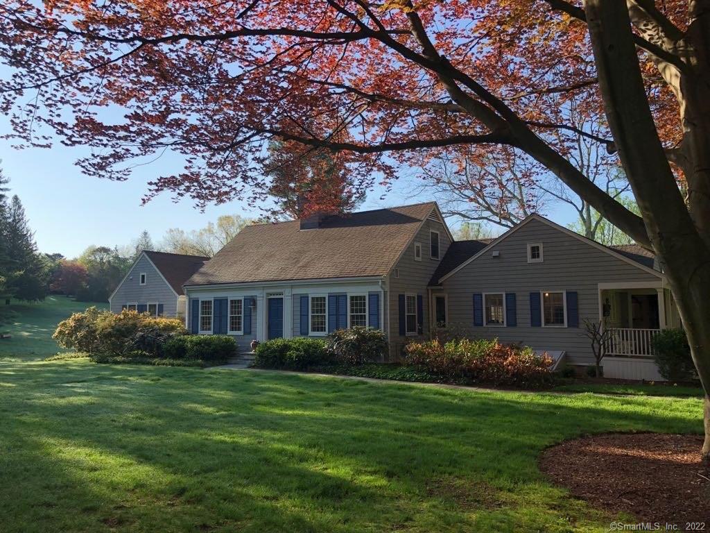 1381 Old Academy Road Fairfield, CT 06824 - Photo 1 of 1 a front view of a house with garden