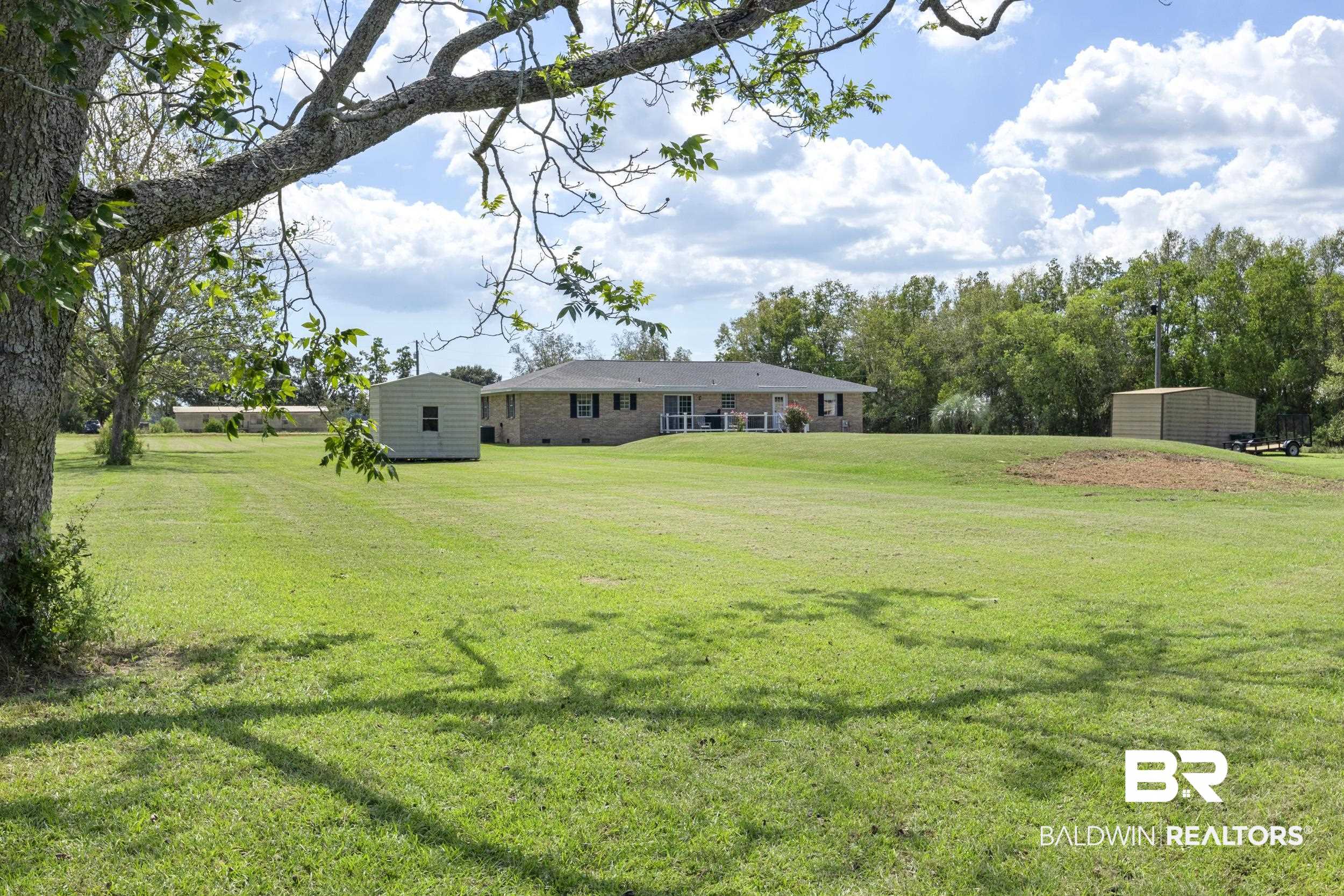 17689 Brewer Road Foley, AL 36535 - Photo 43 of 54 View of yard featuring a storage shed