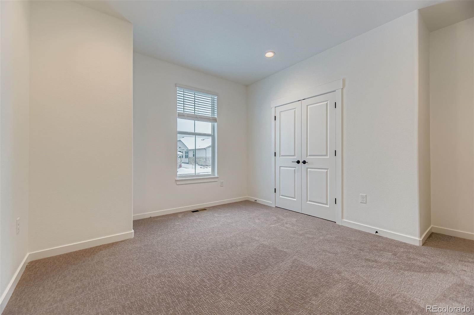 8905 South Riviera Way Aurora, CO 80016 - Photo 17 of 27 an empty room with windows